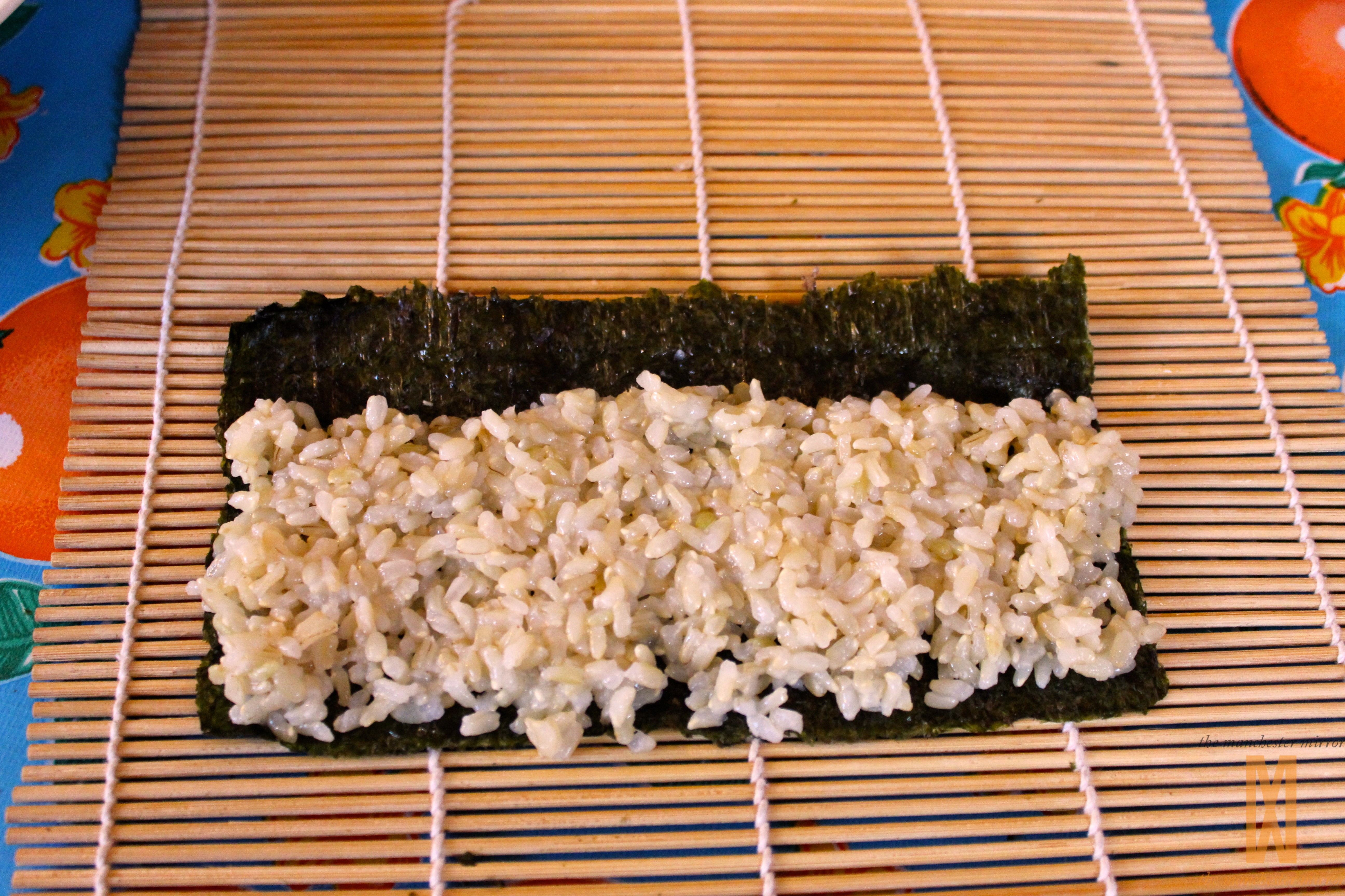 Sushi ingredients, nori seaweed on makisu bamboo mat for rolling, fresh raw  salmon, raw sushi rice, soy sauce and chopsticks on the side Stock Photo -  Alamy