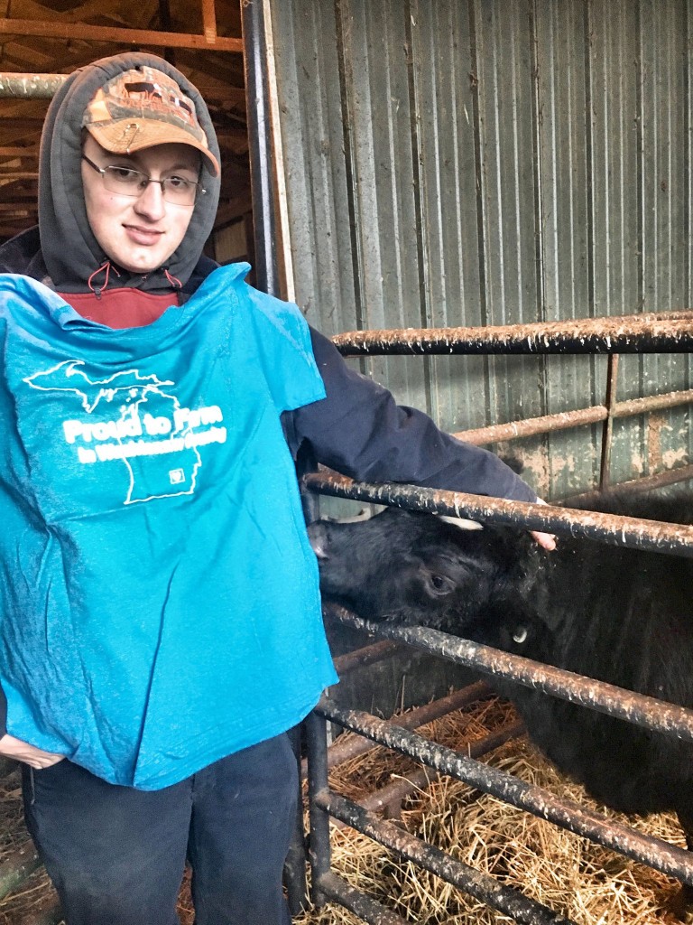 Cody Wacker is a 2014 grad of Manchester High School. He enjoys working as an auto mechanic and loves raising and talking about his animals! The friendly steer in the photo is "Tank" who will be shown and sold at the Lenawee County Fair. Cody said his favorite steer was a Red Angus named "Red" that he had a couple of years ago who followed Cody everywhere. His favorite heifer "Socks", is now his prize cow of three years. One of Cody’s goals is to get his class A CDL (Commercial Driver’s License) so he can drive truck and also farm. Photo and write up courtesy of the Washtenaw Farm Bureau.