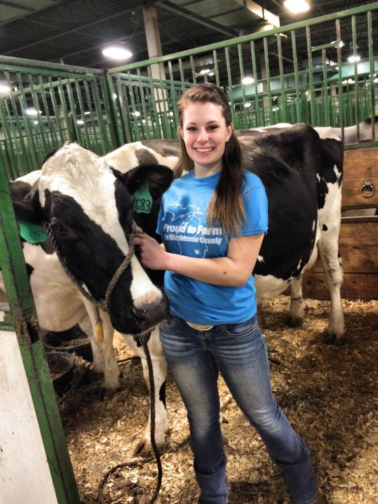 Before most of us were awake this morning, lights were on in barns across the county; farmers were busy milking cows and caring for animals... Here’s Natalie Horning showing her Washtenaw pride. She’s a junior at MSU majoring in Agriculture, food and natural resources education. In these photos she is volunteering at an "I milked a cow" booth for MSU Dairy Club. Photo and write up courtesy of Washtenaw County Farm Bureau.