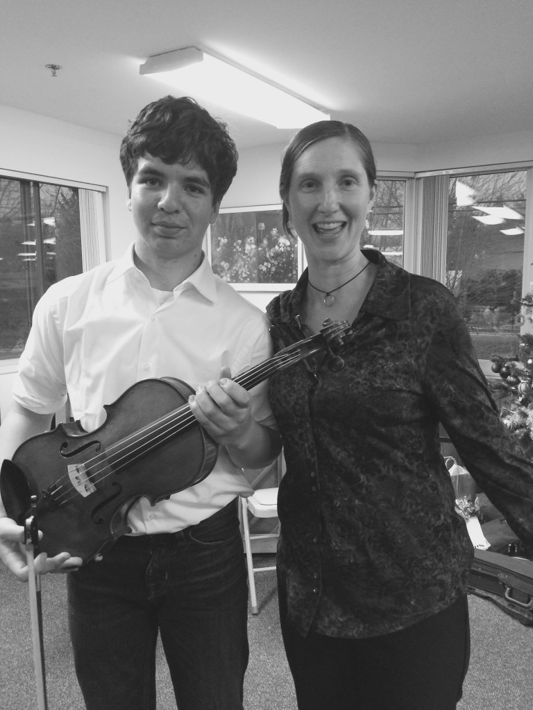 Alden with his violin instructor Carolyn Lukancic in February. Photo courtesy of Aileen Rohwer.