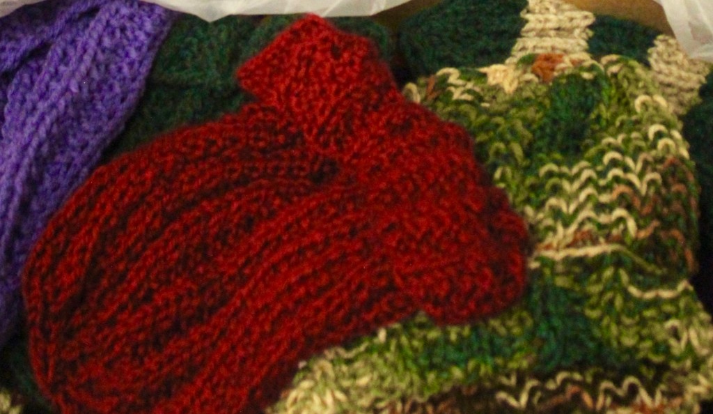 The Chain Gang has partnered with other local groups. Peggy Allen brought in boxes full of hats, lapghans and homemade clothes including these hats made by Lions Club members.