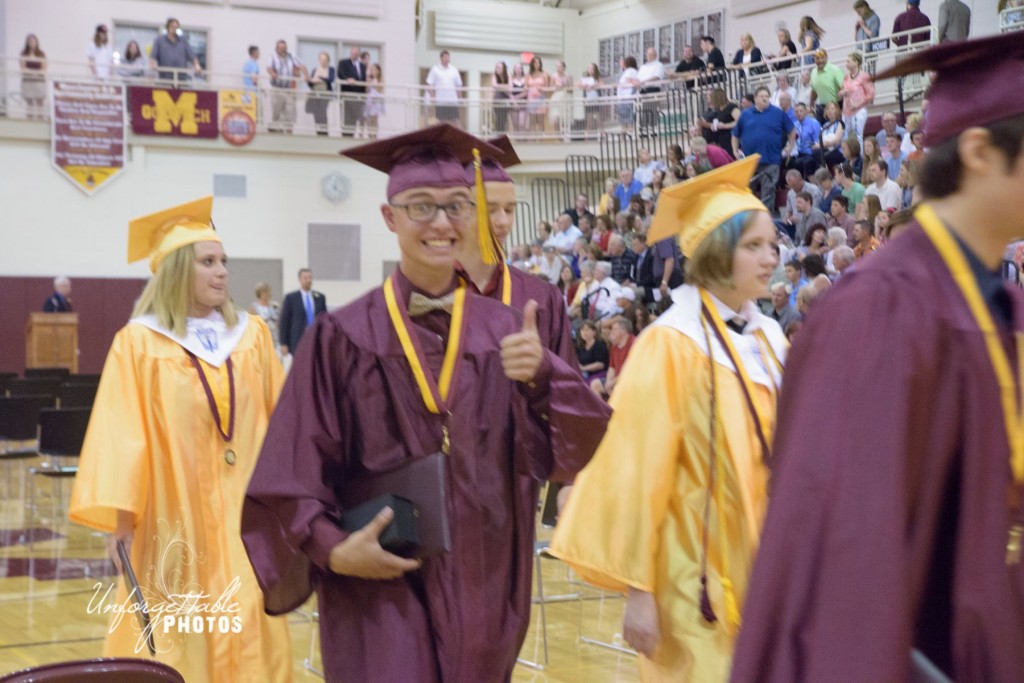 John Beuerle gives a "thumbs up" during the recessional.