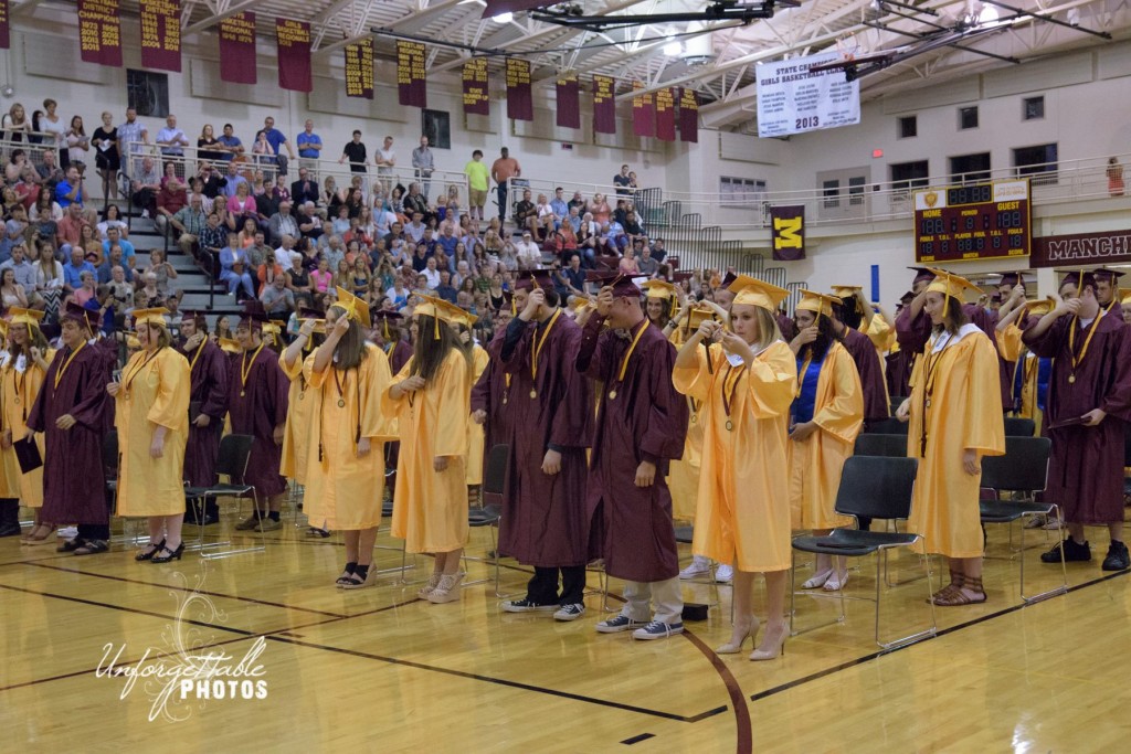 Turning the tassels on their caps, the last step to becoming official alumni of Manchester High School.