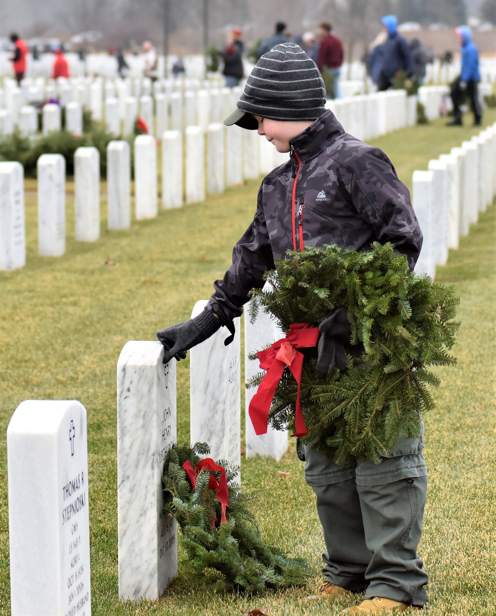 Cub Scouts lay wreaths at Great Lakes National Cemetery The
