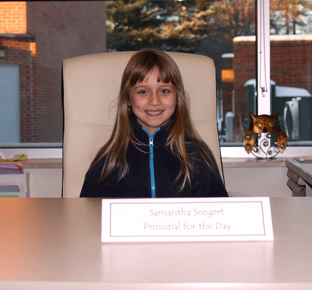 Samantha Seegert sits behind her desk and is ready for the day ahead as Principal for the Day!
