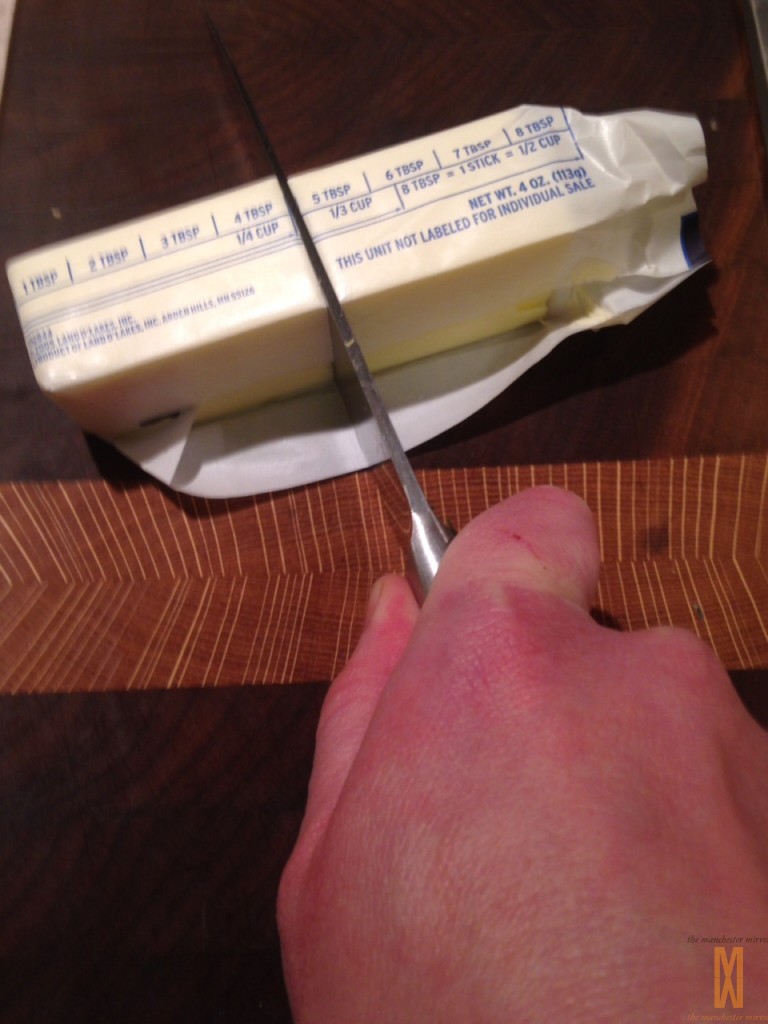 Take half a stick cold butter and cut it up.