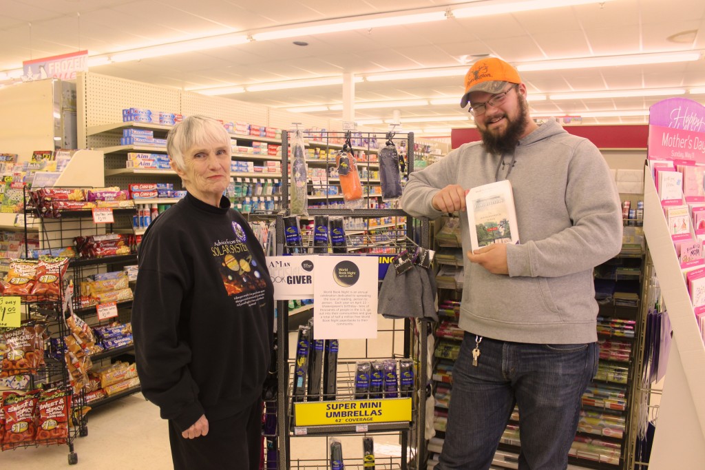 Julia Strimer gave out copies of The Zookeeper’s Wife by Diane Ackerman at the Manchester Market. Here she poses with Matt ???, a Manchester Market employee who happily accepted a copy.