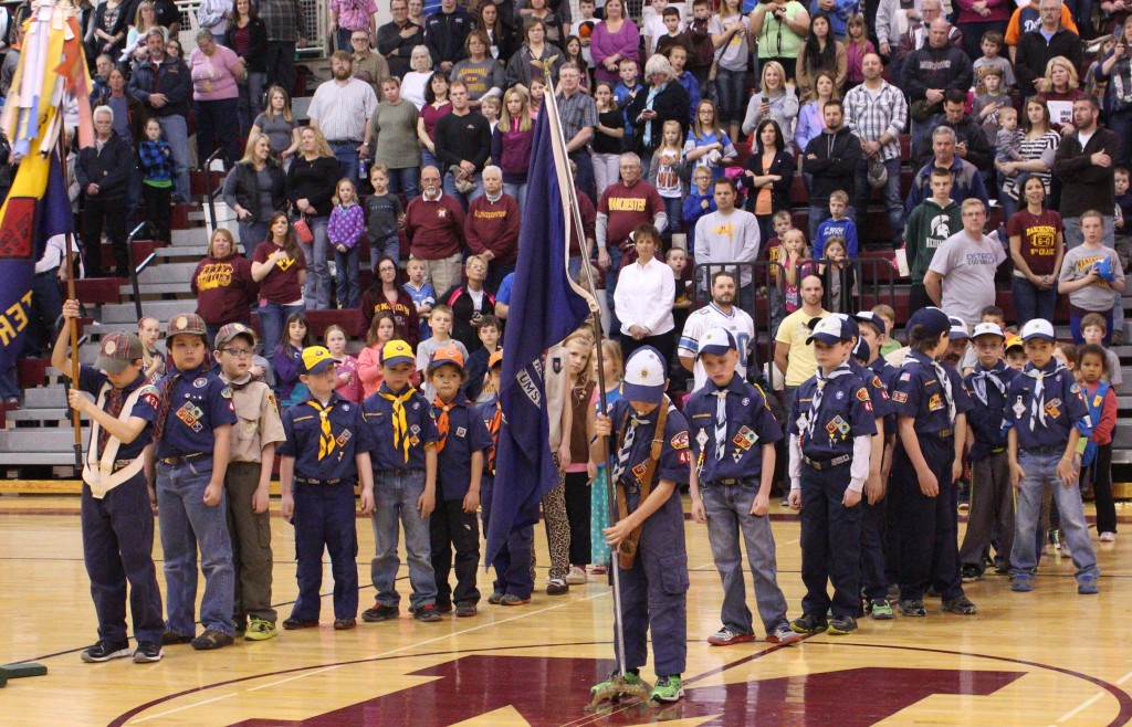 Manchester area scouts opened the game with a flag ceremony.