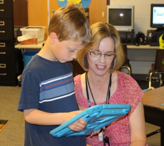 Students in Mrs. Fielder's class certainly know and understand her expectations.  As the bell rang on Friday morning starting school for the day, all students silently grabbed their IPads and started their work, only stopping to print or ask questions.  Mrs. Fielder made her way around the room to check on progress and respond to inquiries.  Thanks to Mrs. Fielder, the educational use of technology in the classroom is now second nature to this group of kids. 