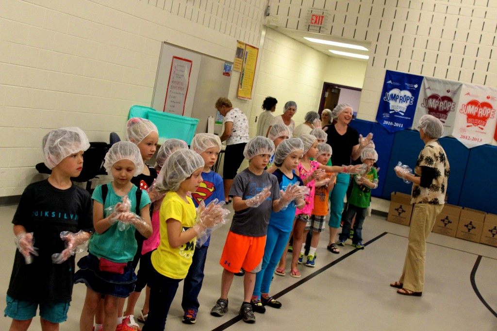 First graders led the charge against hunger, coming into the Klager gym at 9am to bag food.