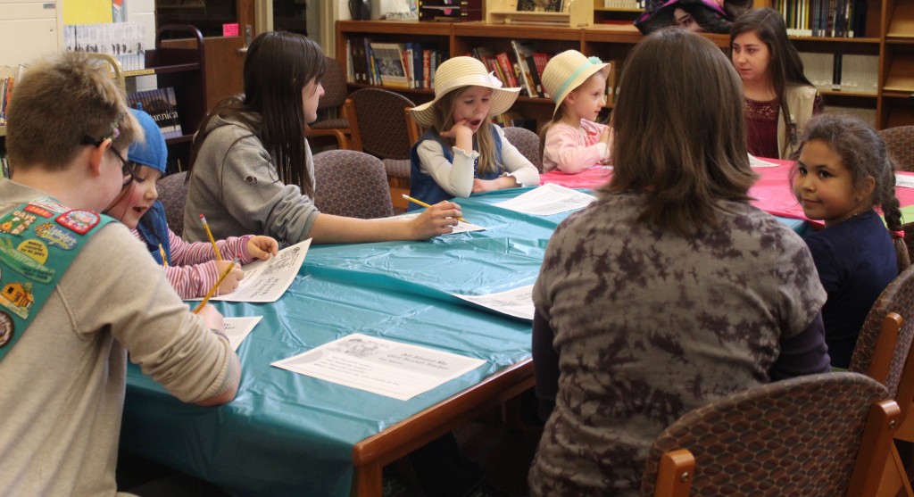 Older and younger Girl Scouts paired up to interview each other.