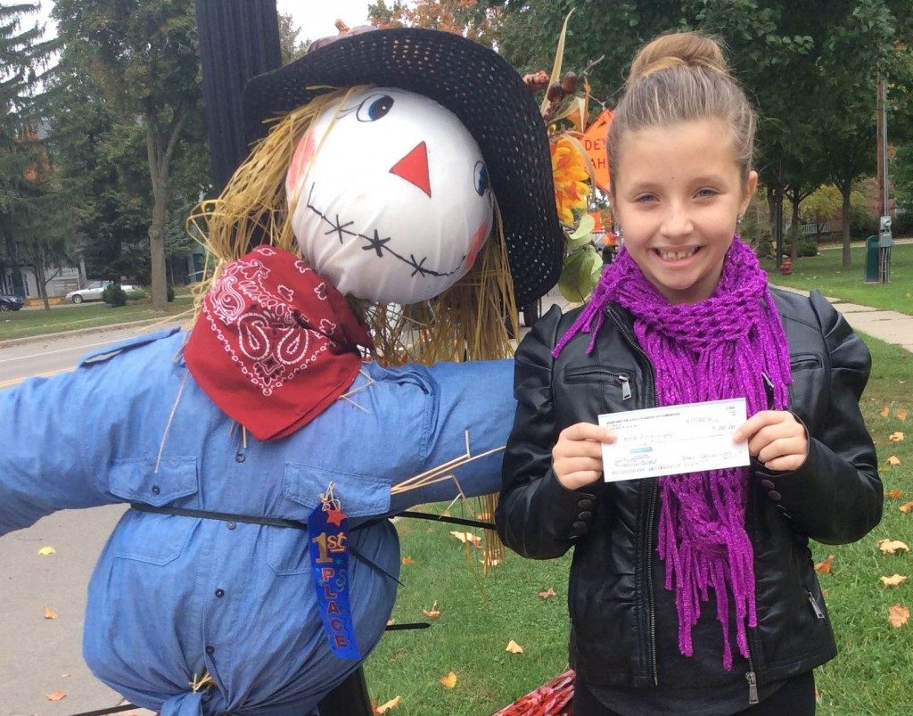 Last year's winner Anna Amburgey of the Builders Club won $50 with her "girl scarecrow" which was on display at the corner of Macomb and West Main last October.