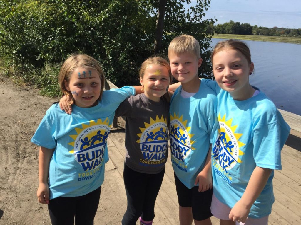 Kayley and Ashley Bobo take a quick break with Wil Taylor and Lila Harvey at the 12th annual Down Syndrome Support Team Buddy Walk. The walk in Washtenaw County is one of 250 Buddy Walks around the country.