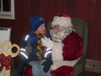 Santa will once again greet children on the Mill Porch after the parade. Photo courtesy of the Chamber of Commerce.