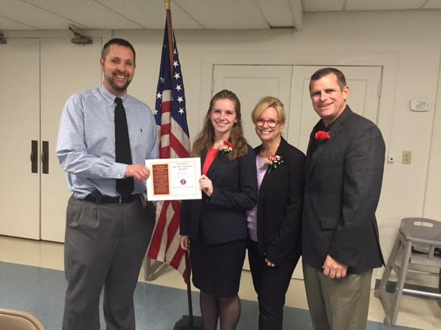 Rachel Fegan receiving recognition at this month's Civic Club meeting. Shown here with high school principal Kevin Mowrer and her parents, Chris and Todd Fegan. Photo courtesy of the Manchester High School.