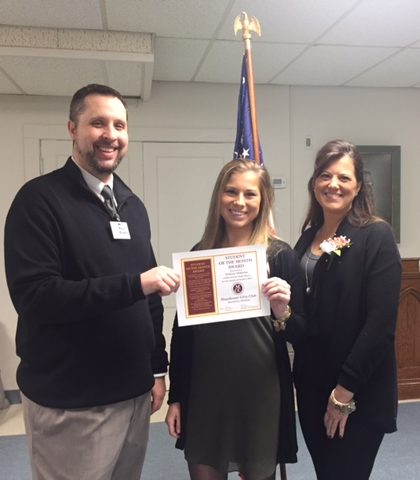 Delanie Osbourne, shown with her mother Carrie Osborne, receiving January student of the month award from Manchester High School principal Kevin Mowrer. Photo courtesy of Manchester High School.