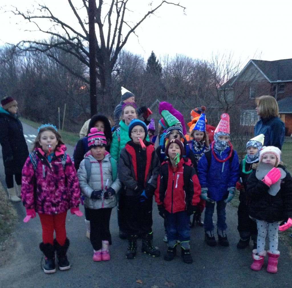 The Walk-to-School Wednesday gang celebrated New Year a few days late last Wednesday, with noisemakers, party hats, and tiaras. About 25 kids and adults participated in the fun!